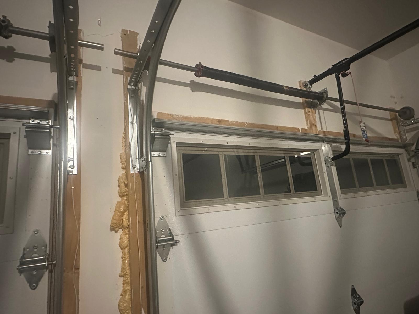 Broken torsion spring on a residential garage door — same-day spring replacement in Barrie, ON